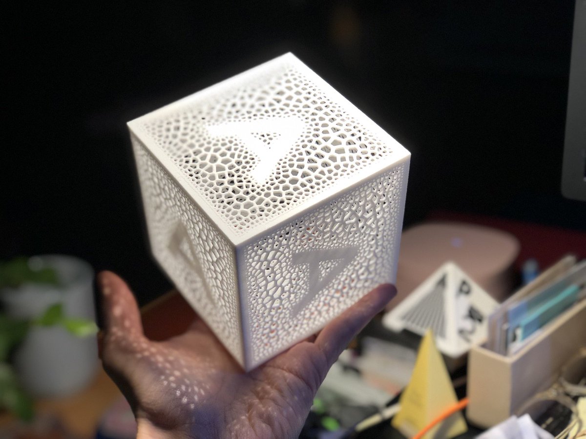 Hand holding cube with the letter A